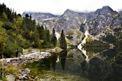 Fototapeta Naklejka Na Ścianę i Meble -  Beautiful scenery in the Tatra Mountains with hiker and reflections