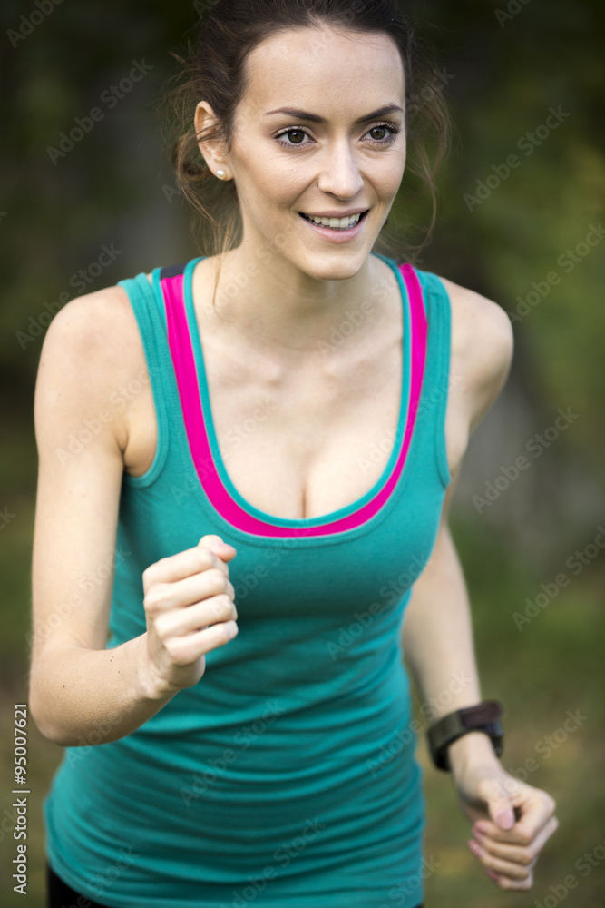 Fototapeta premium Young woman jogging