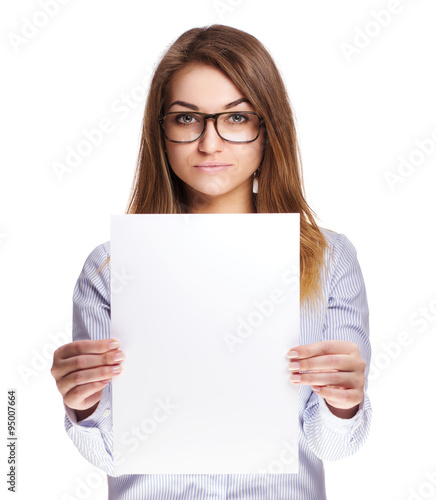 The girl in glasses holding sheet of paper