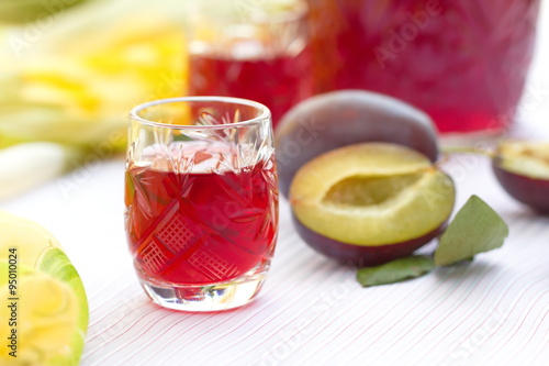 Fényképezés Glasses of plum alcohol with fresh plums