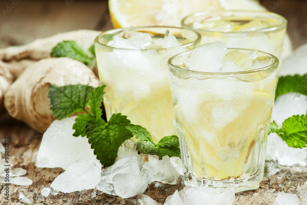 refreshing cold drink with ginger, lemon, ice and mint, selectiv refreshing cold drink with ginger, lemon, ice and mint, selectiv