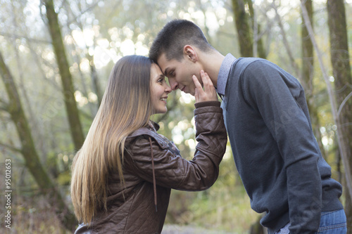 Teen couple at autumn park