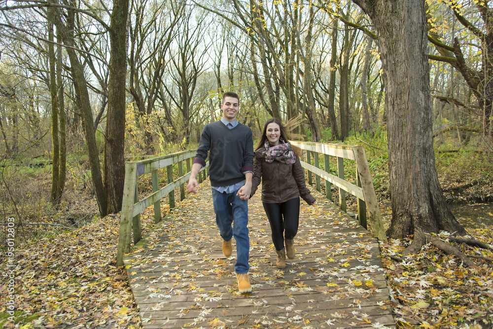 Teen couple at autumn park Teen couple at autumn park