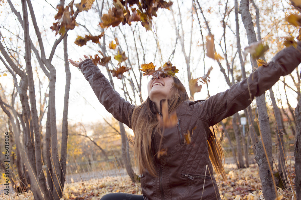 Portrait of a beautiful teenage girl having fun in autumn park Portrait of a beautiful teenage girl having fun in autumn park