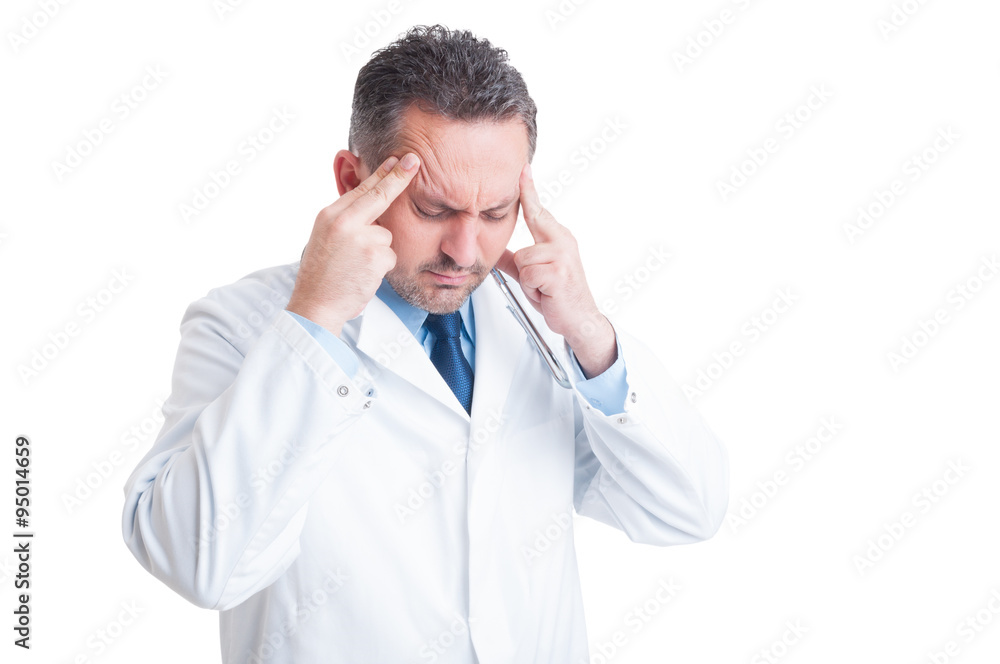 Stressed doctor or medic suffering a headache Stressed doctor or medic suffering a headache