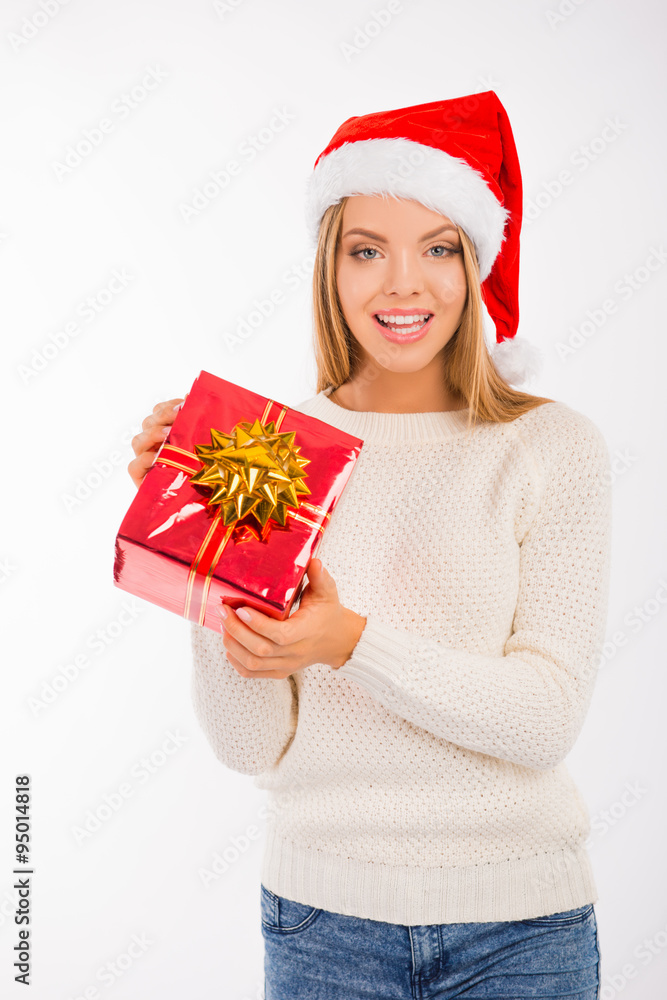 Happy girl in santa hat with Christmas presents Happy girl in santa hat with Christmas presents