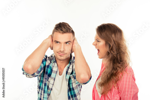 Annoyed young woman shouting at her boyfriend