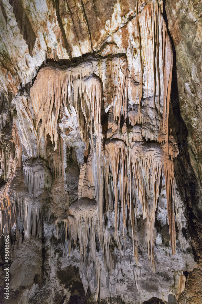 Cave inside with stalactites and stalagmites