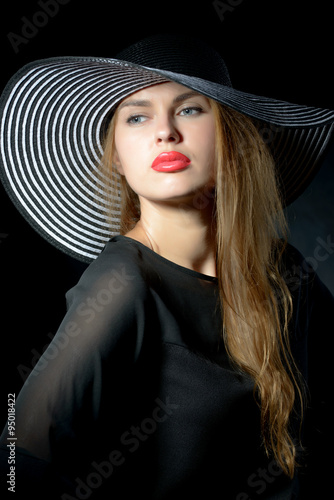 woman with red lips and retro hat
