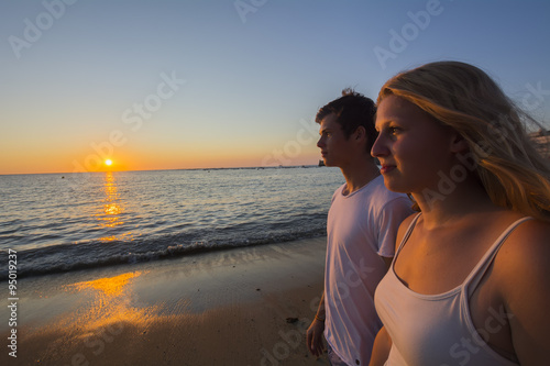 Couple watching the sunset on the beach © max8xam