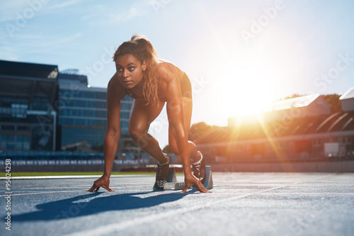 Woman about to start a sprint