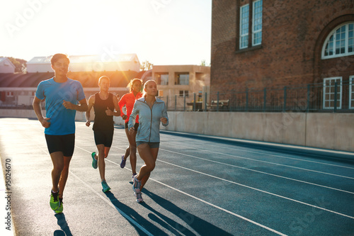 Professional runners running on a race track