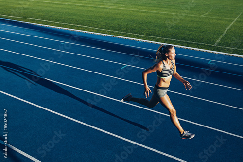 Female sprinter training for race competition