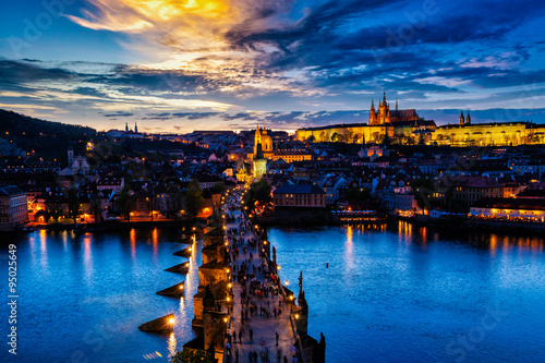Photography Night view of Prague castle and Charles Bridge over Vltava river