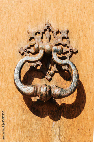 Vintage iron handle on old door