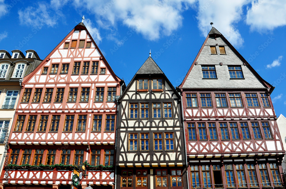 Front view of three typical half-timbered houses.