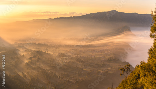 Cemoro Lawang  small village in morning mist. Which situated on the edge of massive north-east of Mount Bromo, East Java, Indonesia © inookphoto