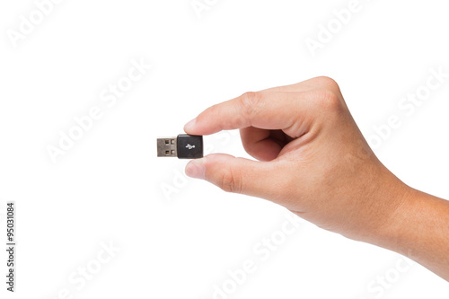 Hand holding USB device isolated on white