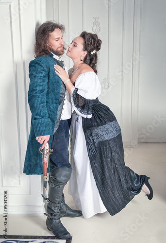 Beautiful couple woman and man in medieval clothes