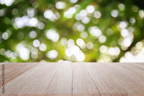 Empty top wooden table and sunny abstract blurred bokeh