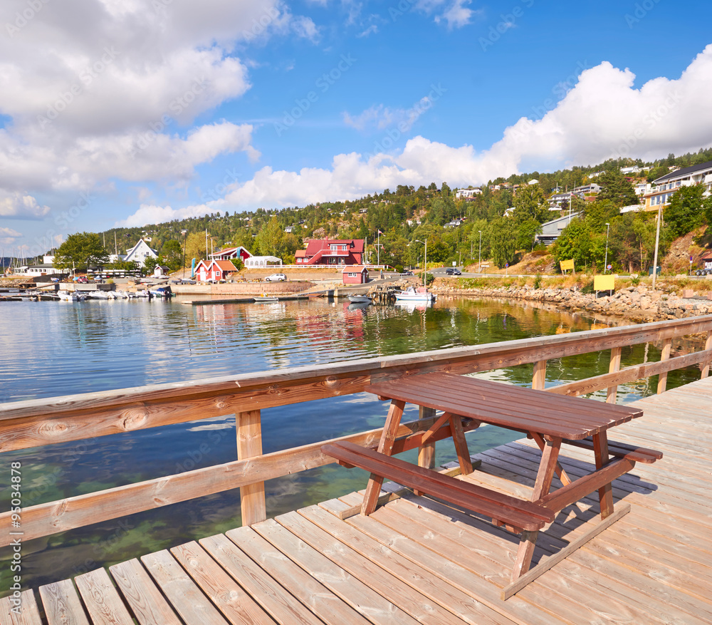 Fototapeta premium Picnic table, View of Southern Norway landscape