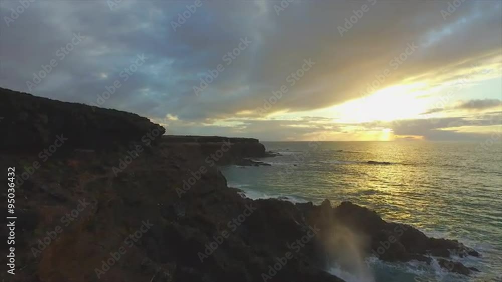 AERIAL: Rough rocky shore with high cliffs above the ocean AERIAL: Rough rocky shore with high cliffs above the ocean