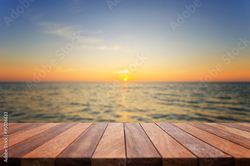 Empty top of wooden table and view of sunset or sunrise backgrou © SKT Studio