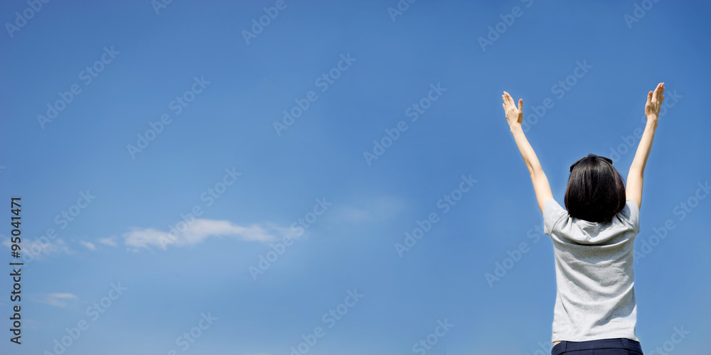 female with arms out spread standing outdoors female with arms out spread standing outdoors