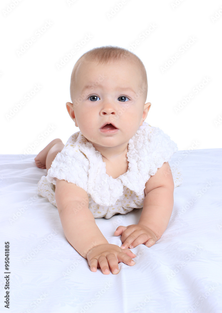 Adorable baby girl in cute clothes on blanket