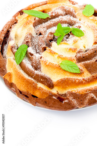 Isolated two-tone homemade color cake with mint leaves