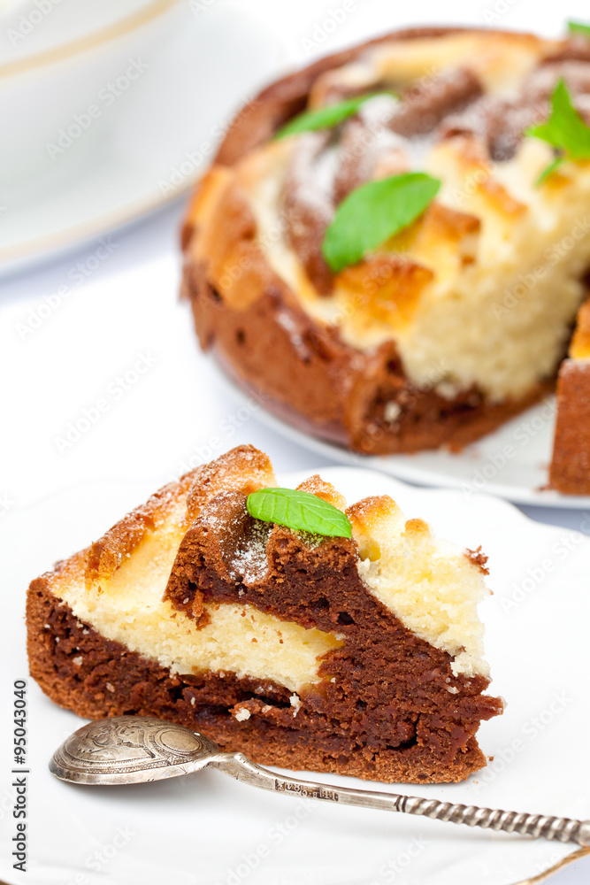 Isolated two-tone homemade color cake with mint leaves Isolated two-tone homemade color cake with mint leaves