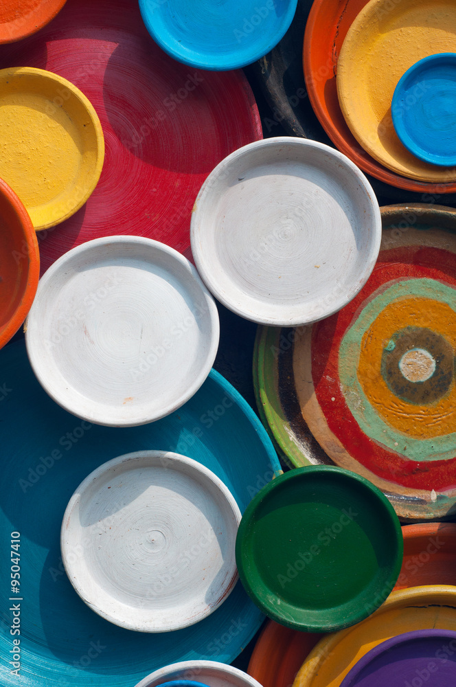 Colorful plates background in sunny day Colorful plates background in sunny day