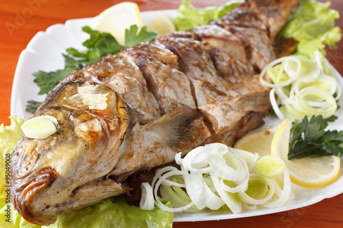 Roasted carp fish with vege...
