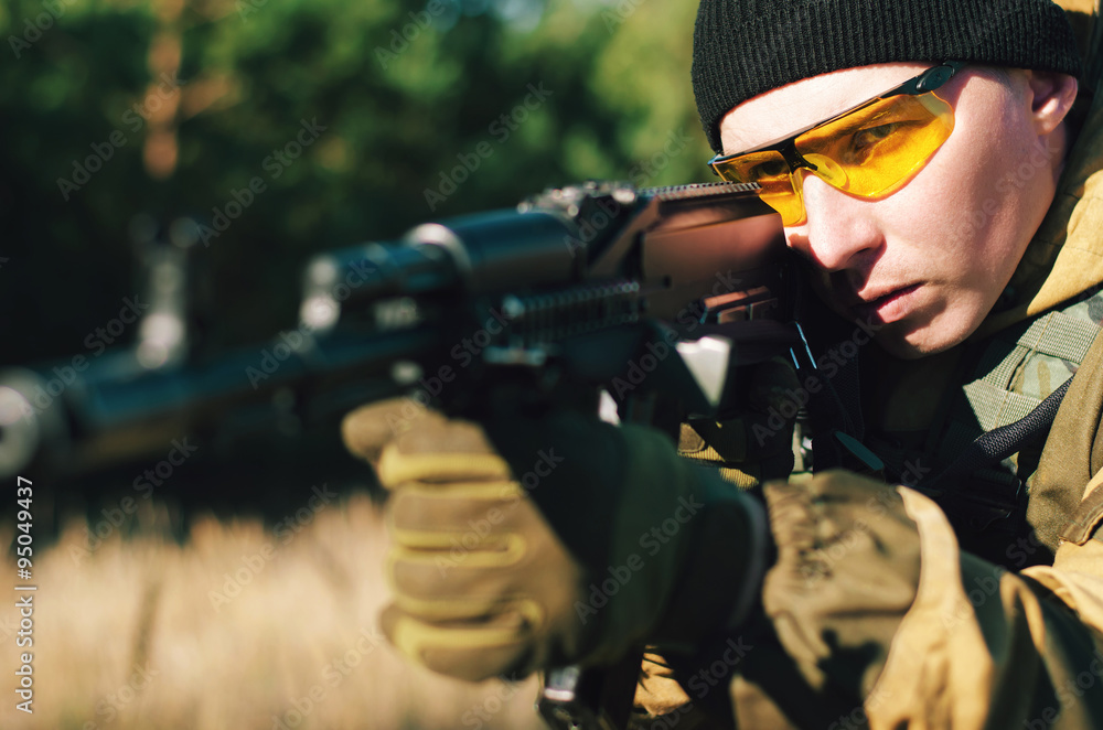 soldiers to aim and shoot at a target with automatic weapons soldiers to aim and shoot at a target with automatic weapons