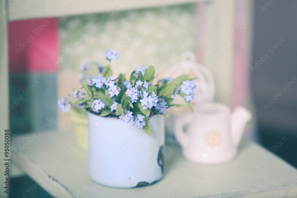 Forget-me-not in rustic cup Forget-me-not in rustic cup
