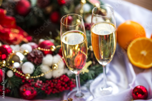 Two champagne glass on christmas background