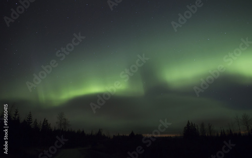 A beautiful scene during awesome effect in the sky. The northern lights filled the sky in early November.