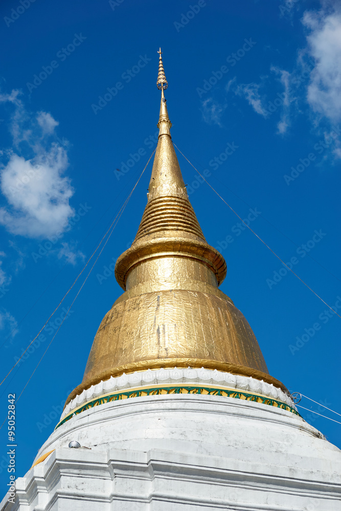 Golden pagoda under blue sky
