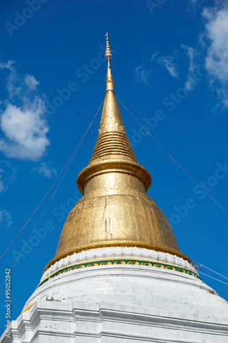 Golden pagoda under blue sky