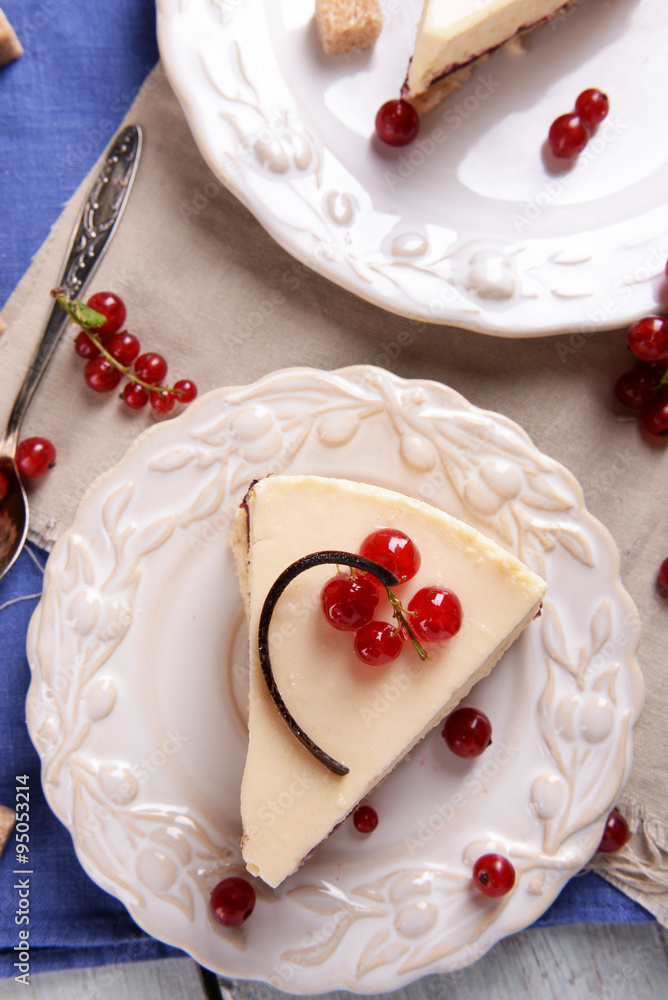 Tasty cheesecake with berries on table close up Tasty cheesecake with berries on table close up