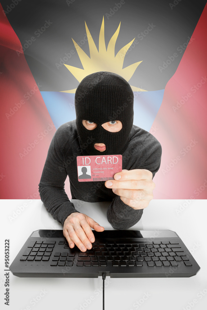 Hacker with flag on background holding ID card in hand - Antigua and Barbuda Hacker with flag on background holding ID card in hand - Antigua and Barbuda