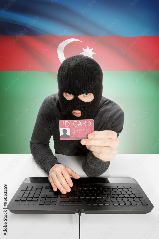 Hacker with flag on background holding ID card in hand - Azerbaijan Hacker with flag on background holding ID card in hand - Azerbaijan