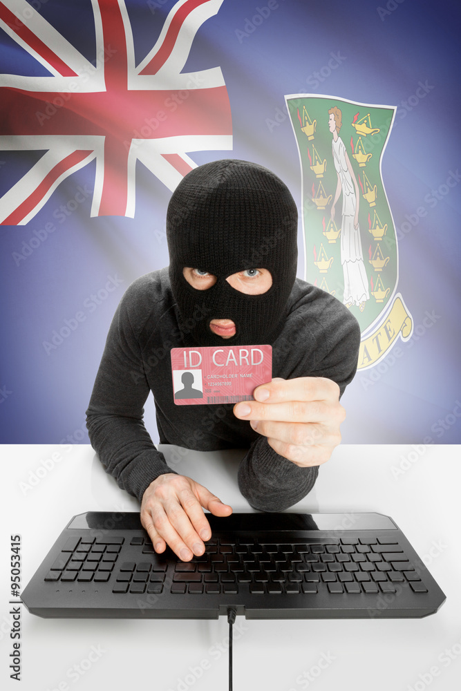 Hacker with flag on background holding ID card in hand - British Virgin Islands Hacker with flag on background holding ID card in hand - British Virgin Islands