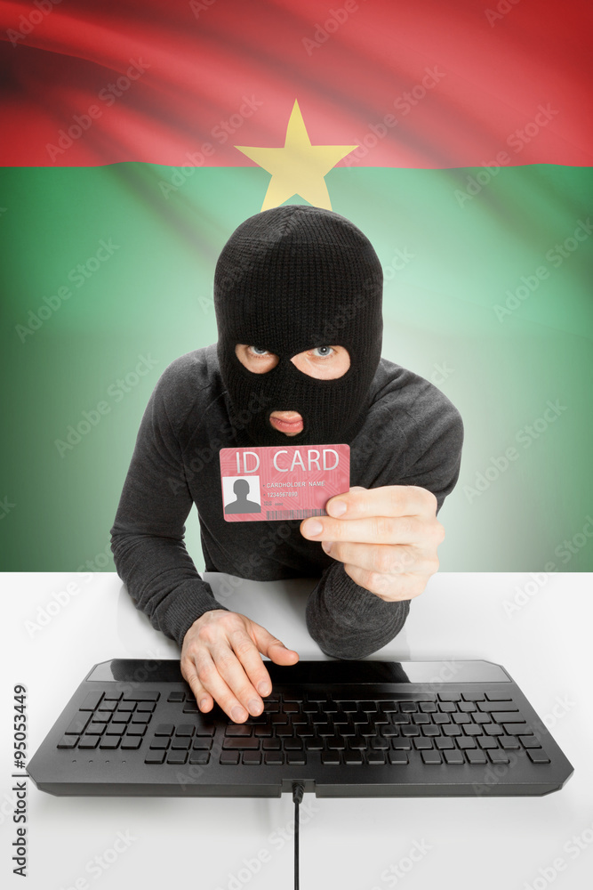 Hacker with flag on background holding ID card in hand - Burkina Faso Hacker with flag on background holding ID card in hand - Burkina Faso
