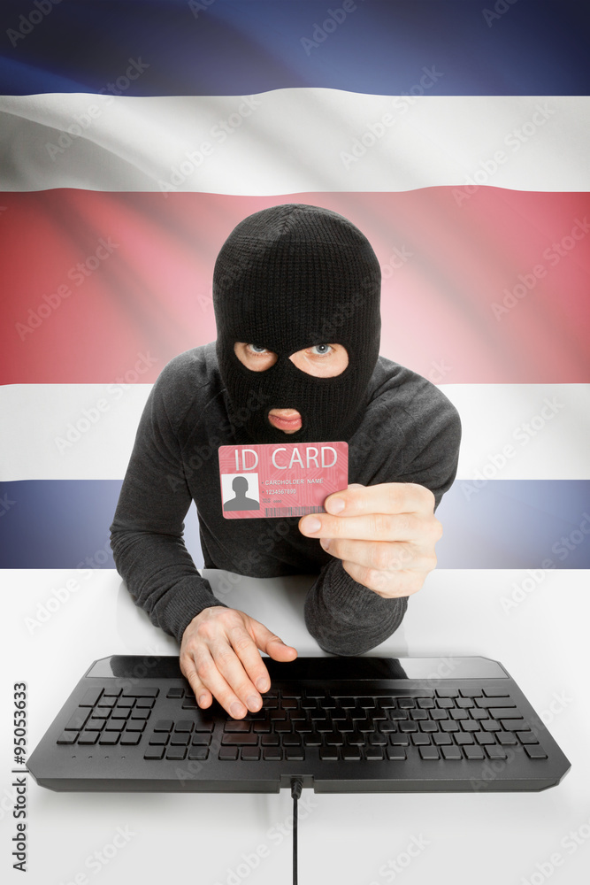 Hacker with flag on background holding ID card in hand - Costa Rica Hacker with flag on background holding ID card in hand - Costa Rica