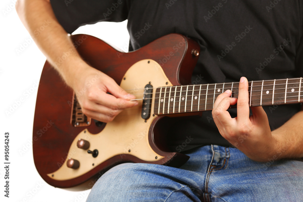 Young musician playing electric guitar close up Young musician playing electric guitar close up