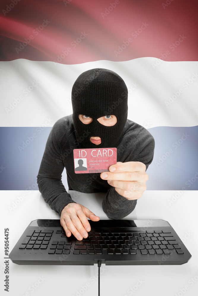 Hacker with flag on background holding ID card in hand - Netherlands Hacker with flag on background holding ID card in hand - Netherlands
