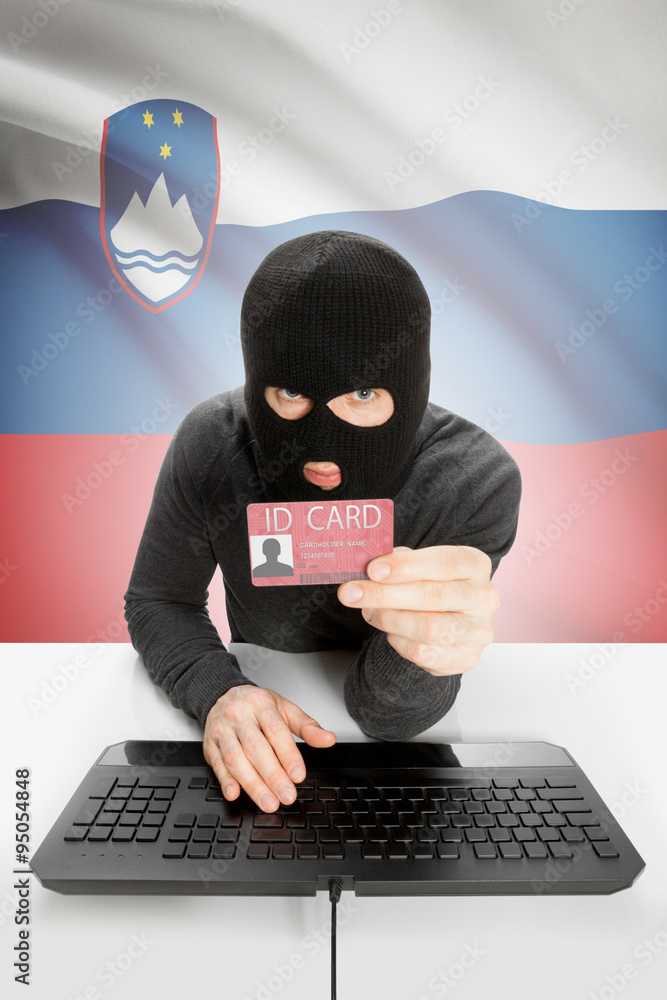 Hacker with flag on background holding ID card in hand - Slovenia Hacker with flag on background holding ID card in hand - Slovenia