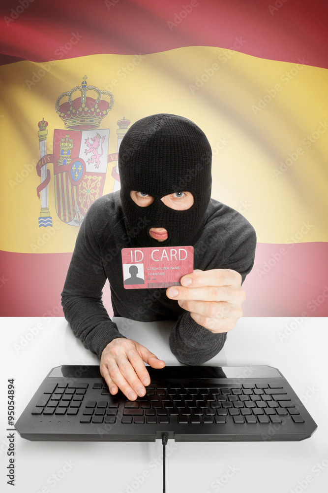 Hacker with flag on background holding ID card in hand - Spain Hacker with flag on background holding ID card in hand - Spain