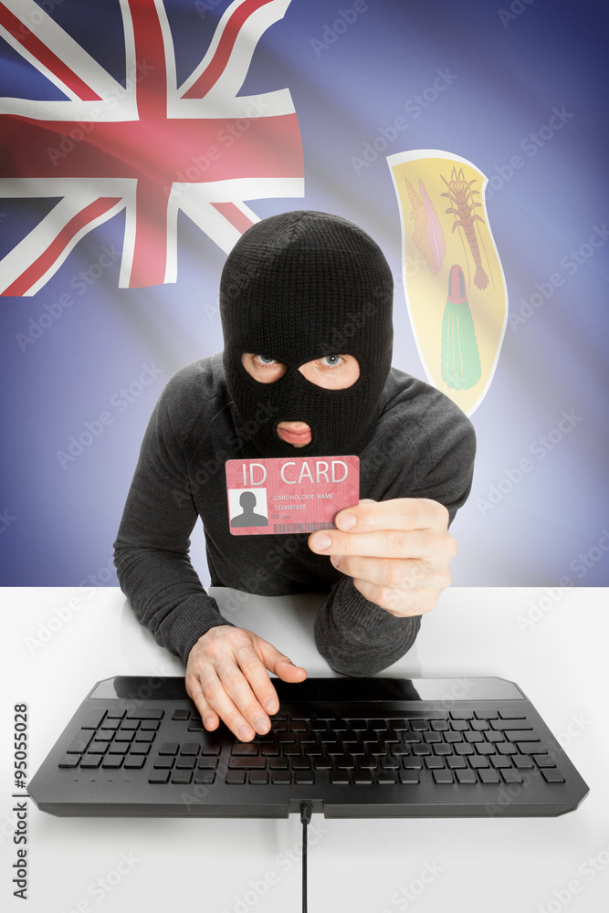 Hacker with flag on background holding ID card in hand - Turks and Caicos Islands Hacker with flag on background holding ID card in hand - Turks and Caicos Islands